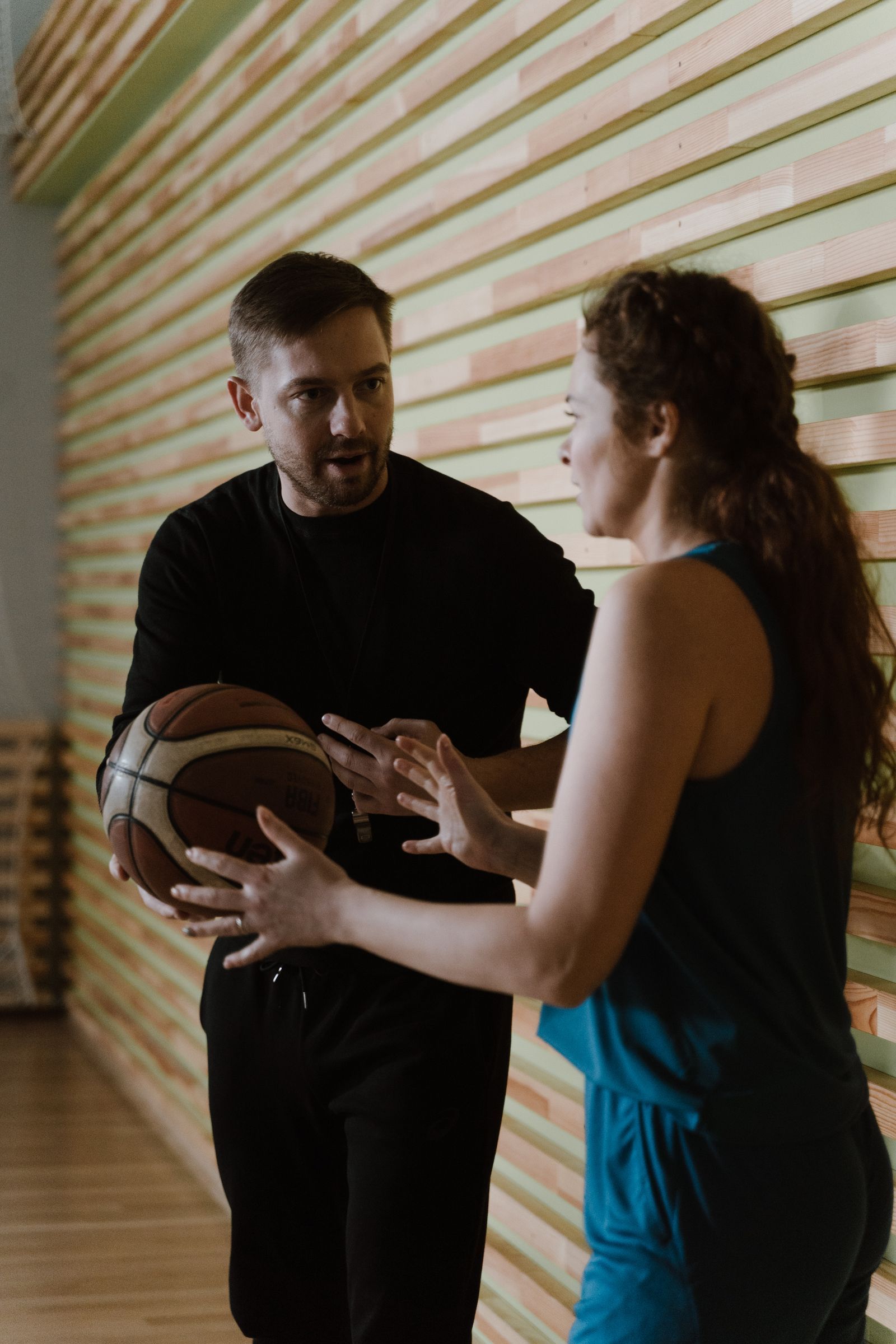 Coach working through a drill with a player